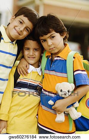 Portrait of three schoolboys standing together View Large Photo Image Picture - Portrait of three schoolboys standing together. Fotosearch