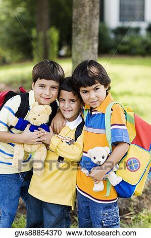 Portrait of three schoolboys standing together View Large Photo Image Stock Image - Portrait of three schoolboys standing together. Fotosearch