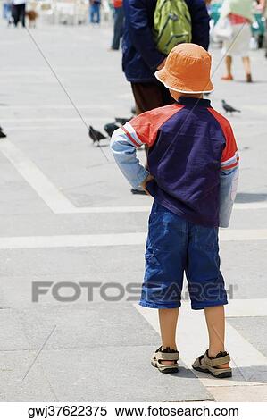 Rear view of a boy standing, Venice, Veneto, Italy View Large Photo Image Stock Photography - Rear view of a boy standing, Venice, Veneto, Italy. Fotosearch