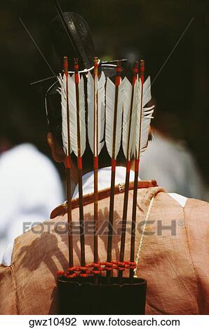 Stock Image - Rear view of a person carrying a quiver with arrows on his shoulders, Hollyhock Festival, Kyoto Prefecture, Japan. Fotosearch