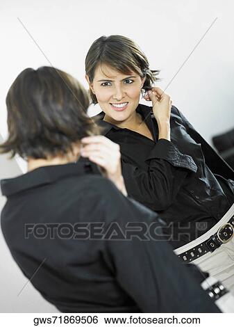Reflection of a businesswoman in a mirror View Large Photo Image Stock Photograph - Reflection of a businesswoman in a mirror. Fotosearch