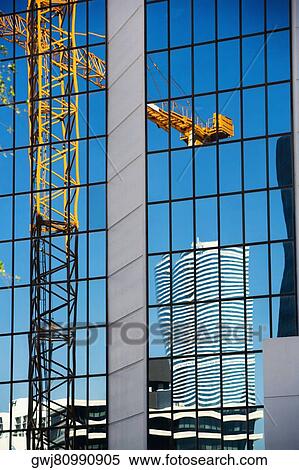 Stock Photography - Reflection of a crane on a building, Miami, Florida, USA. Fotosearch