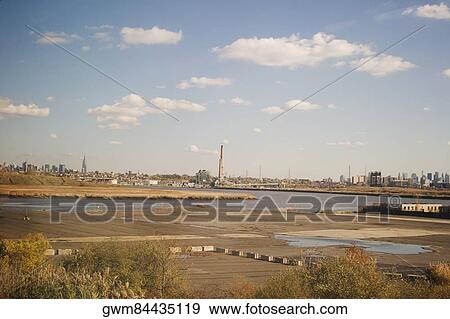 River with a city in the background View Large Photo Image Stock Photo - River with a city in the background. Fotosearch