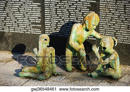Sculptures in front of a wall View Large Photo Image Stock Image - Sculptures in front of a wall. Fotosearch