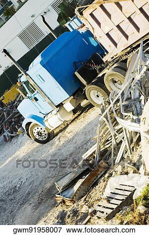 Semi-truck in front of a building View Large Photo Image Stock Photo - Semi-truck in front of a building. Fotosearch