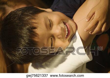 Side profile of a boy smiling View Large Photo Image Stock Photo - Side profile of a boy smiling. Fotosearch