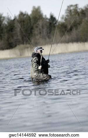 Side profile of a mature man fishing in the river View Large Photo Image Stock Image - Side profile of a mature man fishing in the river. Fotosearch