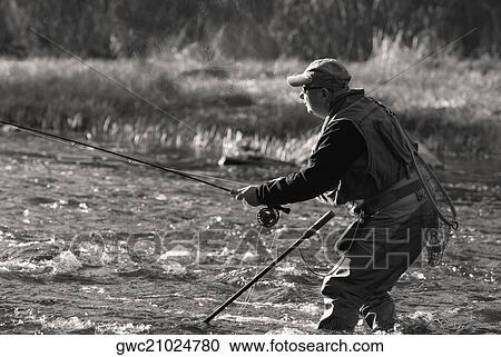 Side profile of a mature man fishing in the river View Large Photo Image Stock Image - Side profile of a mature man fishing in the river. Fotosearch