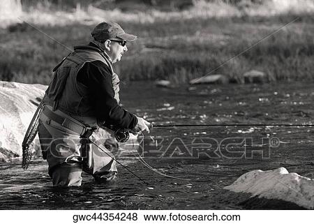 Side profile of a mature man fishing in the river View Large Photo Image Stock Photo - Side profile of a mature man fishing in the river. Fotosearch