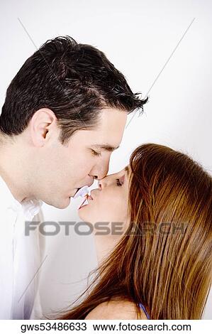 Side profile of a mid adult man sucking a pacifier with a young woman kissing him View Large Photo Image Stock Image - Side profile of a mid adult man sucking a pacifier with a young woman kissing him. Fotosearch