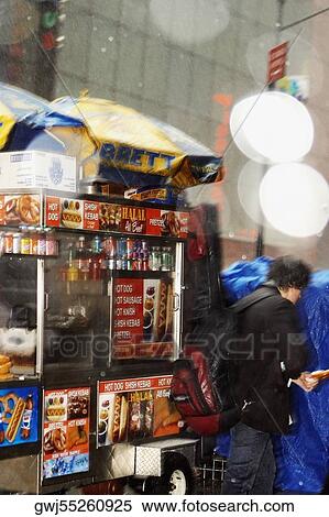 Side profile of a tourist in front of market stall, New York City, New York State, USA View Large Photo Image Stock Photography - Side profile of a tourist in front of market stall, New York City, New York State, USA. Fotosearch