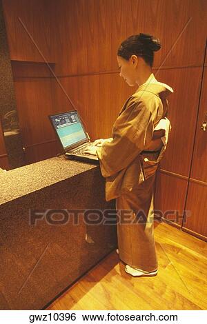 Side profile of a woman using a laptop, Tokyo Prefecture, Japan View Large Photo Image Stock Photograph - Side profile of a woman using a laptop, Tokyo Prefecture, Japan. Fotosearch