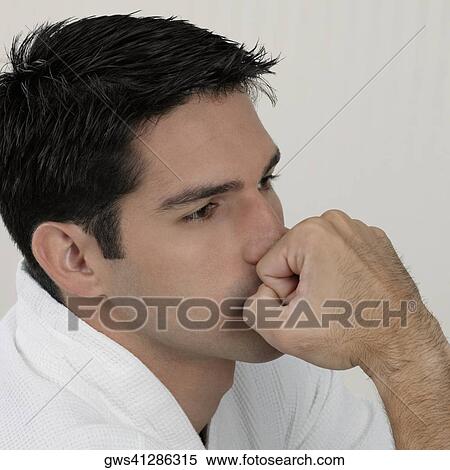 Side profile of a young man looking pensive View Large Photo Image Stock Photography - Side profile of a young man looking pensive. Fotosearch