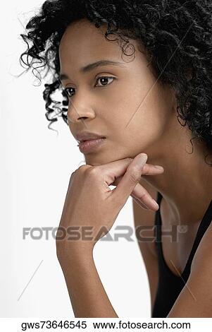 Side profile of a young woman thinking View Large Photo Image Stock Photography - Side profile of a young woman thinking. Fotosearch
