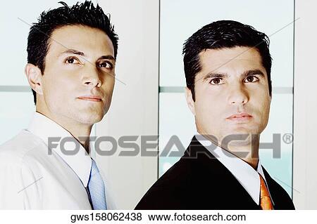 Side profile of two businessmen View Large Photo Image Stock Photo - Side profile of two businessmen. Fotosearch