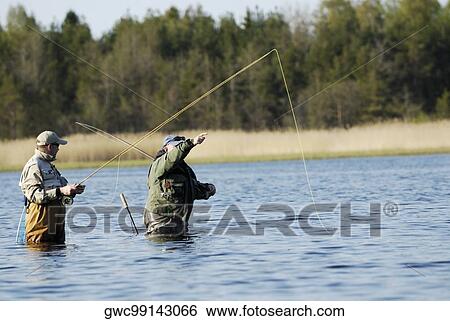 Side profile of two mature men fishing in the river View Large Photo Image Stock Photograph - Side profile of two mature men fishing in the river. Fotosearch