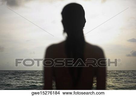Picture - Silhouette of a young woman. Fotosearch