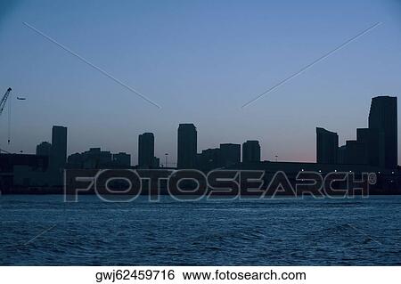 Silhouette of buildings at dusk, Miami, Florida, USA View Large Photo Image Stock Photograph - Silhouette of buildings at dusk, Miami, Florida, USA. Fotosearch