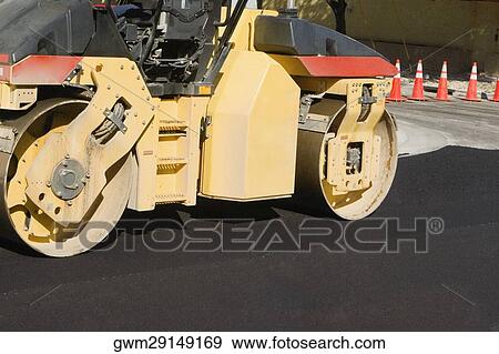 Stock Photo - Steamroller on the road. Fotosearch