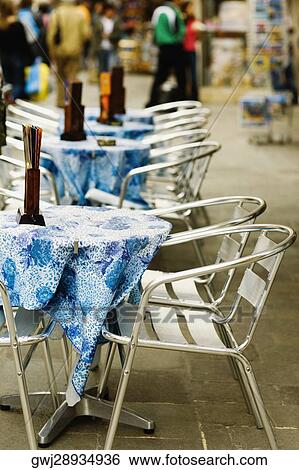Tables and chairs in a restaurant View Large Photo Image Stock Photograph - Tables and chairs in a restaurant. Fotosearch