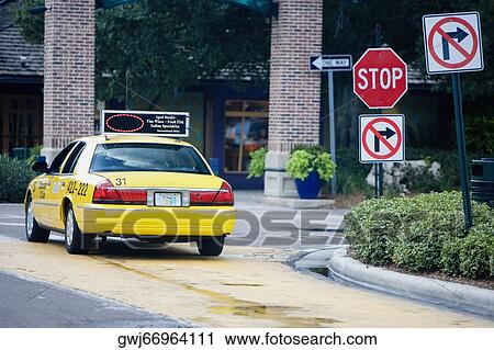 Taxi moving on the road, Savannah, Georgia, USA View Large Photo Image Stock Image - Taxi moving on the road, Savannah, Georgia, USA. Fotosearch