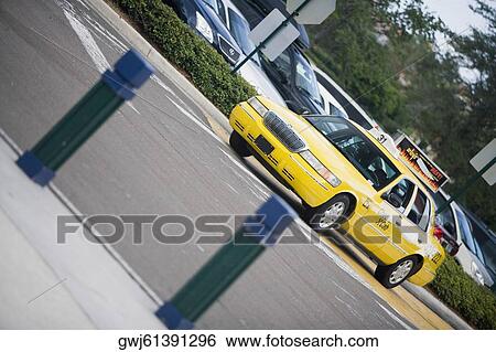Taxi moving on the road, Savannah, Georgia, USA View Large Photo Image Stock Photograph - Taxi moving on the road, Savannah, Georgia, USA. Fotosearch
