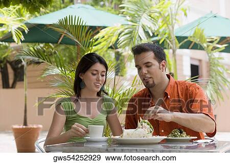 Teenage girl and a mid adult man sitting in a restaurant View Large Photo Image Stock Photo - Teenage girl and a mid adult man sitting in a restaurant. Fotosearch