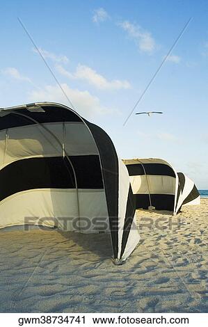 Tents on the beach View Large Photo Image Stock Image - Tents on the beach. Fotosearch
