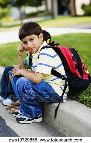 Three schoolboys sitting together View Large Photo Image Stock Photo - Three schoolboys sitting together. Fotosearch