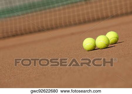 Three tennis balls on a tennis court View Large Photo Image Stock Image - Three tennis balls on a tennis court. Fotosearch