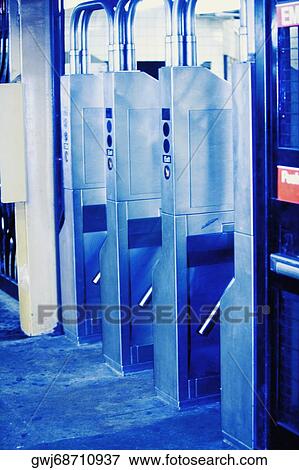 Ticket gates at a subway station View Large Photo Image Stock Photo - Ticket gates at a subway station. Fotosearch