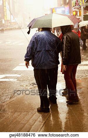 Tourists standing at the roadside, New York City, New York State, USA View Large Photo Image Stock Photograph - Tourists standing at the roadside, New York City, New York State, USA. Fotosearch