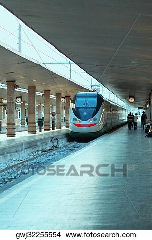 Train at a railroad station platform, Rome, Italy View Large Photo Image Picture - Train at a railroad station platform, Rome, Italy. Fotosearch