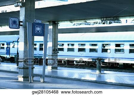 Stock Photo - Train at a railroad station platform, Rome, Italy. Fotosearch