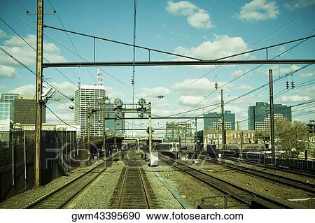 Train at a railroad station View Large Photo Image Stock Image - Train at a railroad station. Fotosearch