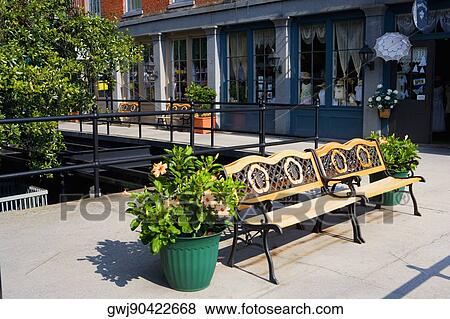Two empty benches in front of a building, Savannah, Georgia, USA View Large Photo Image Stock Photo - Two empty benches in front of a building, Savannah, Georgia, USA. Fotosearch