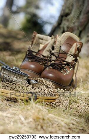 Wading boots with a fishing net and a fishing reel View Large Photo Image Stock Image - Wading boots with a fishing net and a fishing reel. Fotosearch