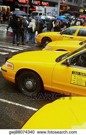 Yellow taxi waiting at the zebra crossing View Large Photo Image Stock Image - Yellow taxi waiting at the zebra crossing. Fotosearch