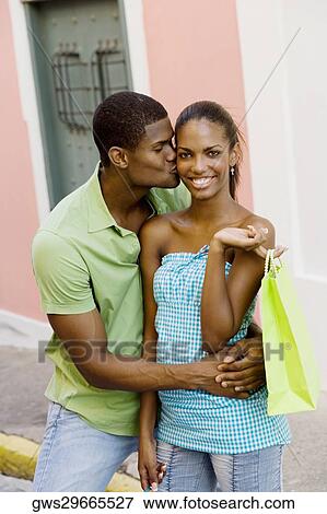 Stock Photo - Young man kissing a teenage girl. Fotosearch