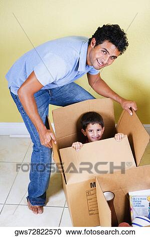 Young man playing with his son View Large Photo Image Stock Image - Young man playing with his son. Fotosearch