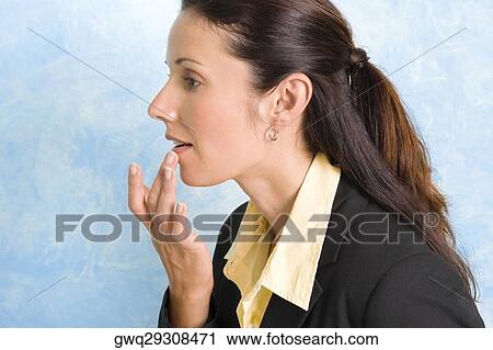 Close-up of a businesswoman applying cream on her lips View Large Photo Image Stock Image - Close-up of a businesswoman applying cream on her lips. Fotosearch