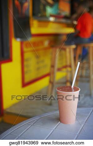Stock Photo - Close-up of a fruit shake on a table. Fotosearch