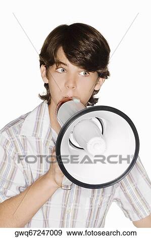 Close-up of a teenage boy blowing a bullhorn View Large Photo Image Stock Photo - Close-up of a teenage boy blowing a bullhorn. Fotosearch