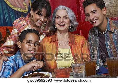 Close-up of a three generation family in a restaurant View Large Photo Image Stock Image - Close-up of a three generation family in a restaurant. Fotosearch