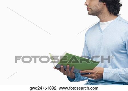 Close-up of a young man holding a book View Large Photo Image Stock Image - Close-up of a young man holding a book. Fotosearch