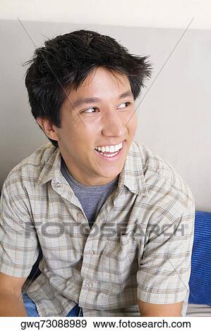 Stock Photo - Close-up of a young man smiling. Fotosearch