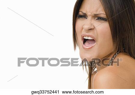Close-up of a young woman shouting View Large Photo Image Stock Image - Close-up of a young woman shouting. Fotosearch
