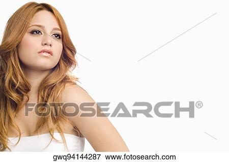 Stock Photo - Close-up of a young woman thinking. Fotosearch