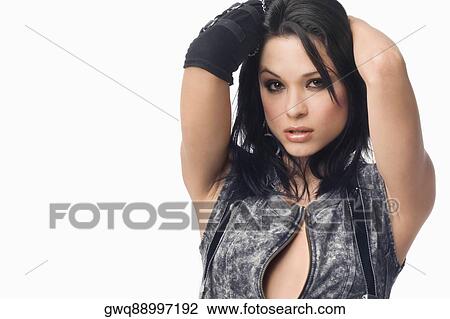 Close-up of a young woman with her hands behind her head View Large Photo Image Stock Image - Close-up of a young woman with her hands behind her head. Fotosearch