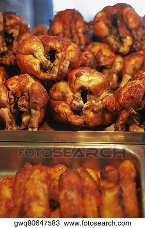 Stock Image - Close-up of barbecue chickens in a restaurant. Fotosearch